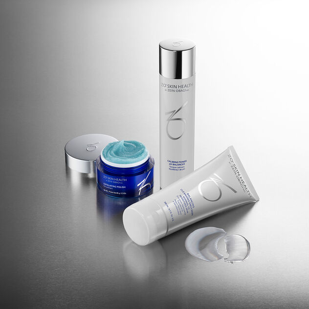 Broad-Spectrum Sunscreen, Rozatrol Accelerated Serum, Balancing Cleansing Emulsion, Hydrating Creme, Sunscreen + Powder and Sunscreen + Primer on grey/silver background